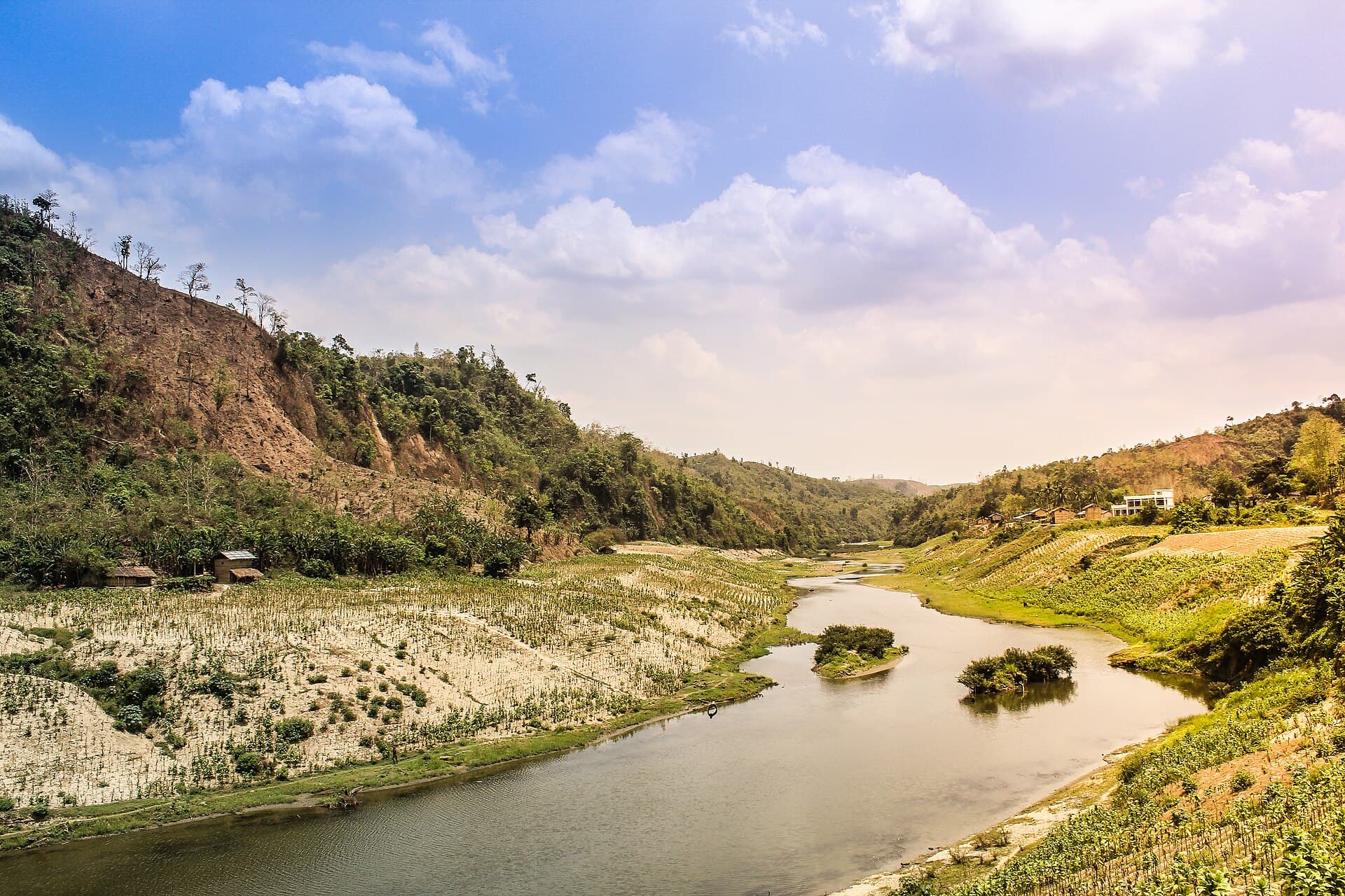 The Sangu River winding between hills under a blue sky, Bandarban