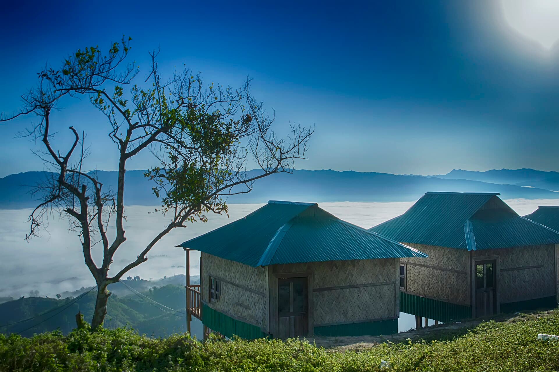 Bamboo hillside cottage overlooking the green hills of Sajek Valley