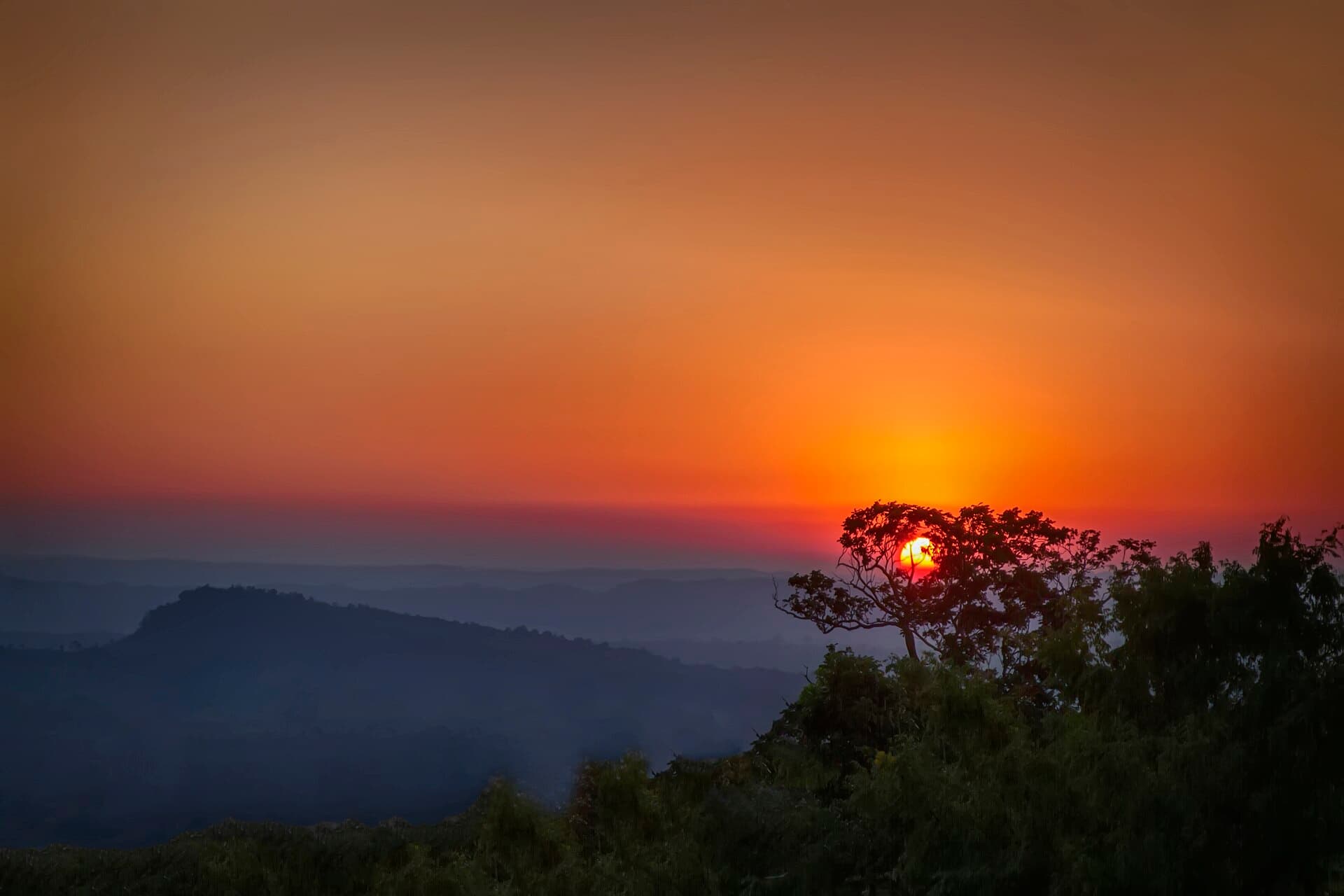 Sunrise over a sea of clouds seen from the helipad at Sajek Valley